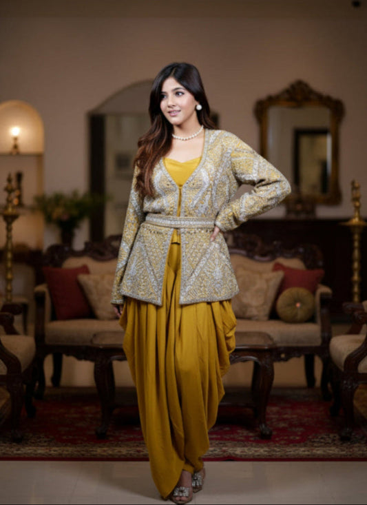 Woman in traditional outfit standing in a decorated room with furniture and mirrors.