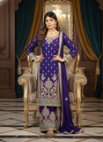 Woman in a traditional purple embroidered outfit sitting on an ornate chair.