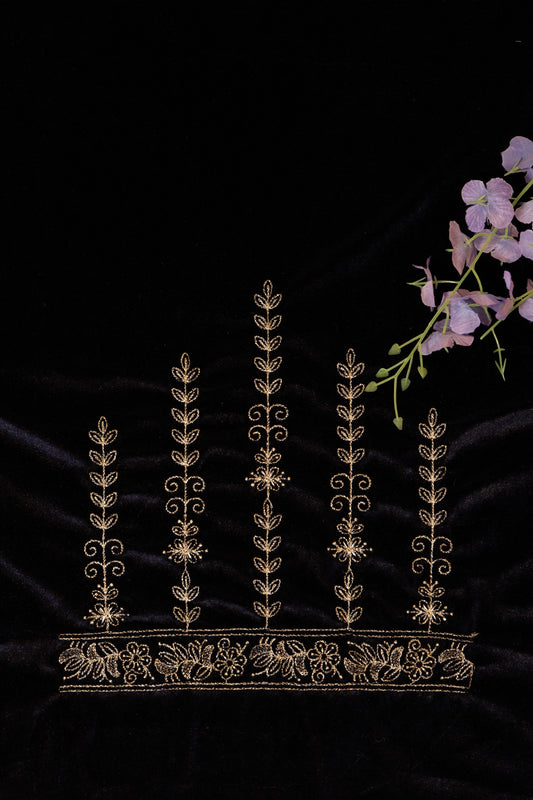 Decorative headband with intricate gold embroidery on a black background