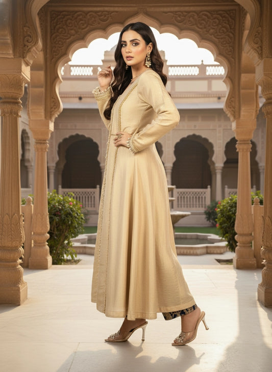 Woman in a beige traditional outfit standing in an ornate architectural setting