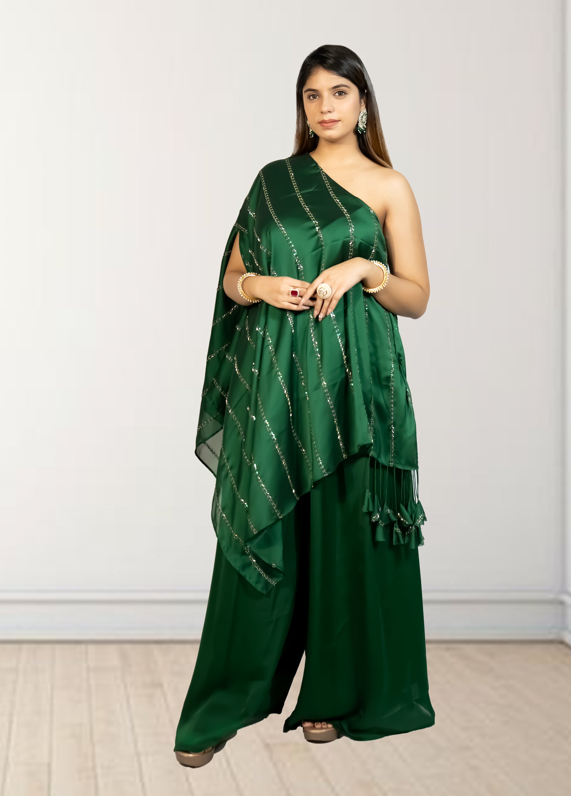 Woman wearing a green saree with a white background
