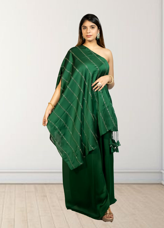 Woman wearing a green saree with a white background