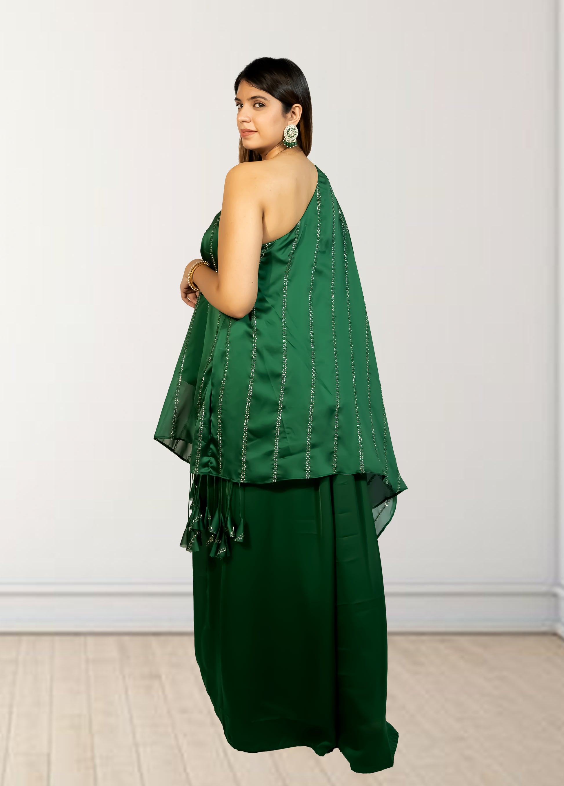Woman wearing a green outfit with a white background