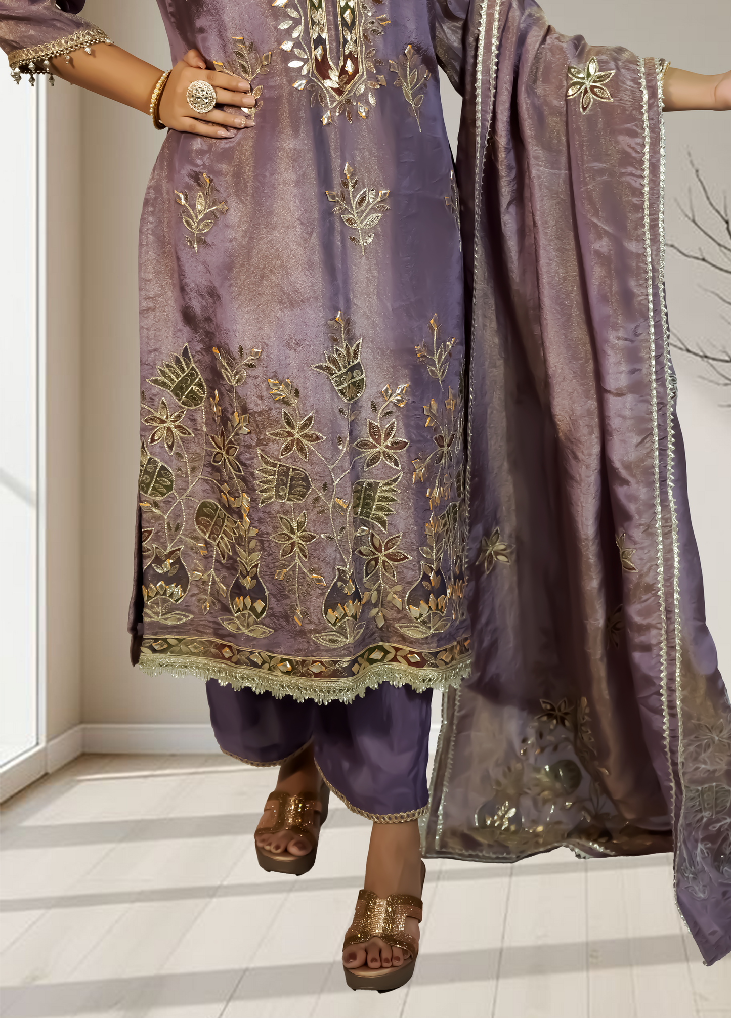 Purple embroidered traditional outfit with a matching dupatta on a neutral background