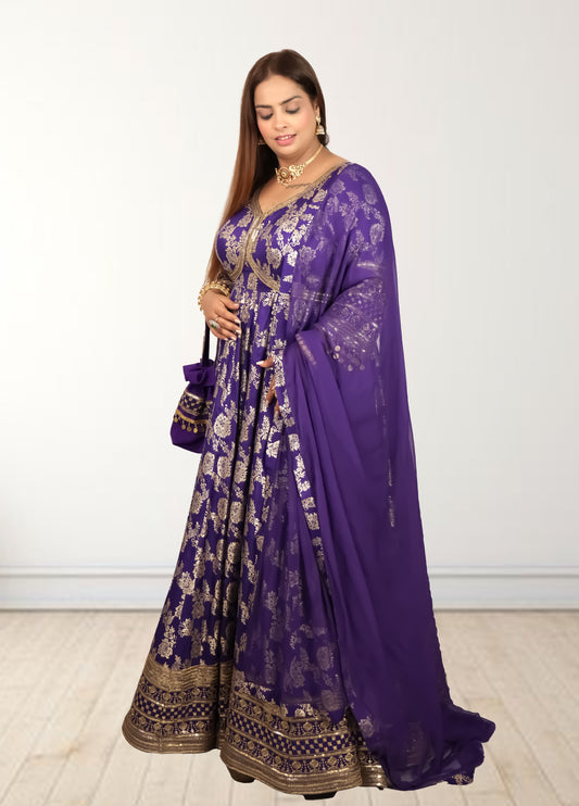 Woman wearing a purple traditional outfit with gold patterns on a white background
