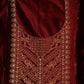 Maroon fabric with intricate gold embroidery