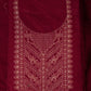 Maroon fabric with intricate gold embroidery on a matching background