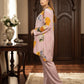 Woman in a floral outfit standing in an ornate room with decorative elements.