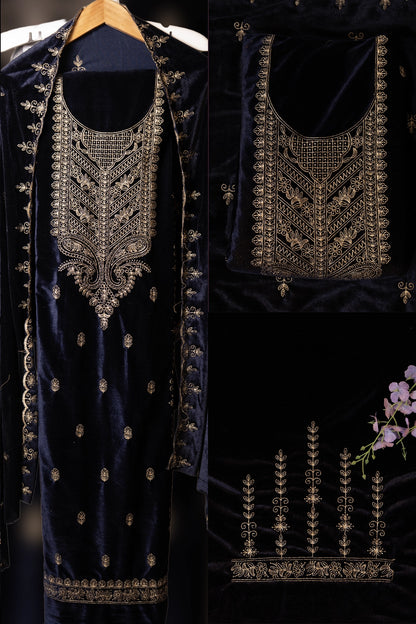 Navy blue embroidered garment with intricate gold detailing on a dark background