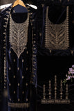 Navy blue embroidered garment with intricate gold detailing on a dark background