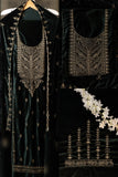 Black embroidered garment with intricate designs on a dark background