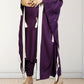 Purple traditional outfit with white accents on a plain background
