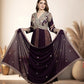 Woman in a purple embroidered traditional outfit with a flowing skirt in a decorated room.