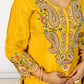 Yellow embroidered traditional outfit with intricate patterns on a plain background