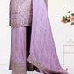 Traditional outfit with embroidered top and pants, draped with a matching dupatta on a white background.
