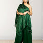Woman wearing a green saree with a white background