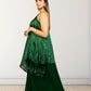 Woman wearing a green saree with a white background