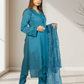 Woman wearing a blue traditional outfit with a matching dupatta indoors.