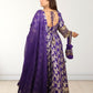 Woman wearing a purple traditional outfit with floral patterns on a white background