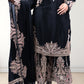 Black traditional outfit with intricate pink embroidery on a white background