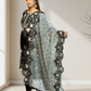 Woman holding a light blue dupatta with floral patterns in a minimal indoor setting