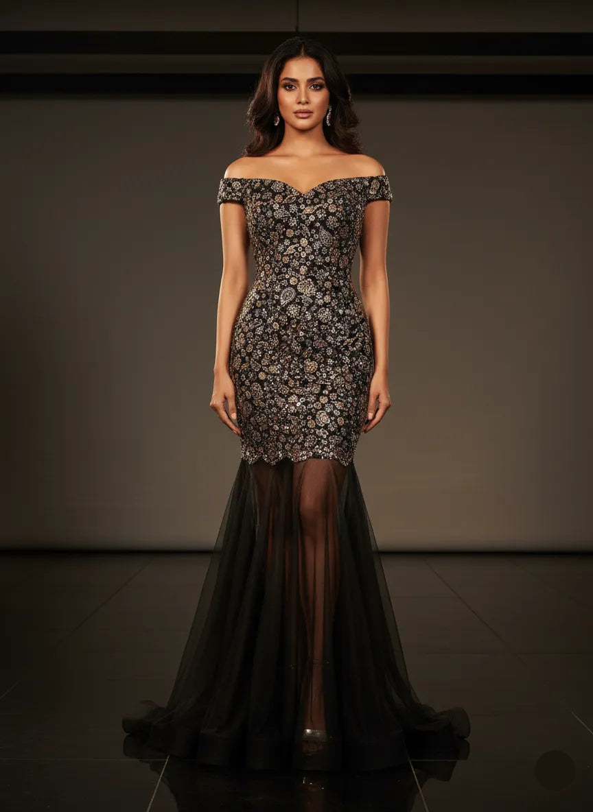 Woman wearing a black off-shoulder dress with floral patterns against a dark background