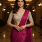Woman in a pink saree with a blurred background