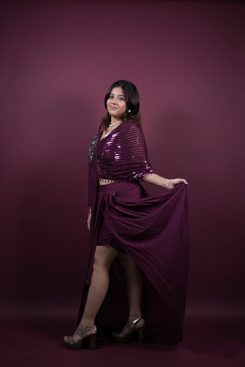 Woman wearing a purple outfit against a purple background