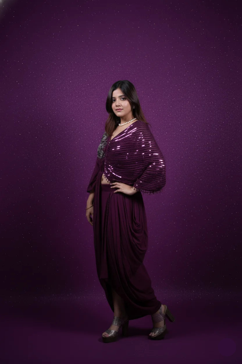 Woman wearing a purple outfit against a purple background