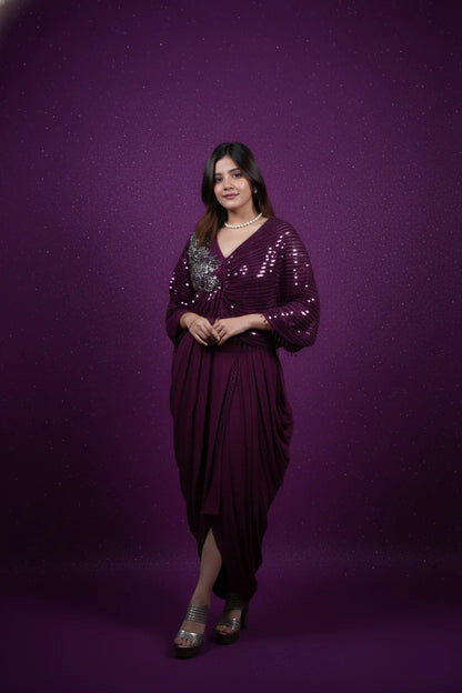 Woman wearing a purple dress with sequin details against a purple background