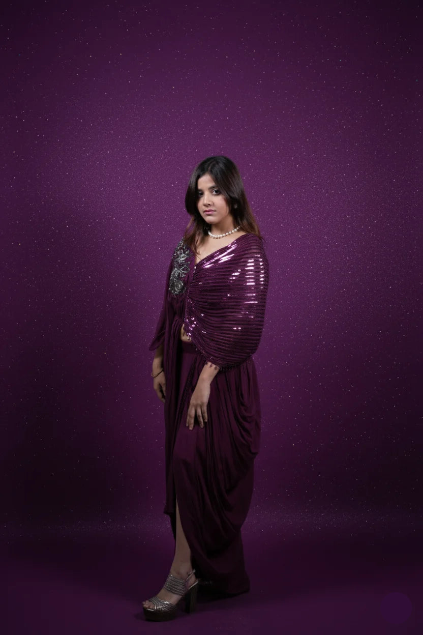 Woman wearing a purple sequin dress against a purple background